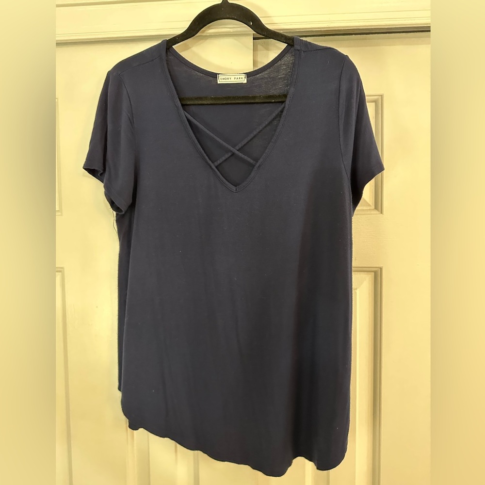 Navy blue tee shirt with criss cross detail.